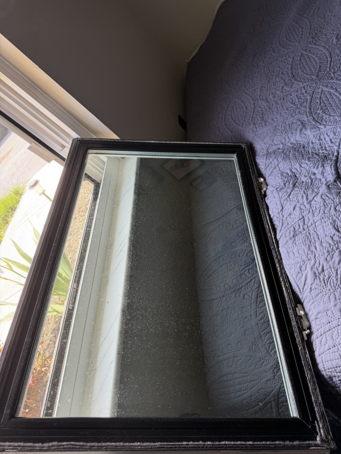 Dirty residential window before DCR cleaning service Johnson County